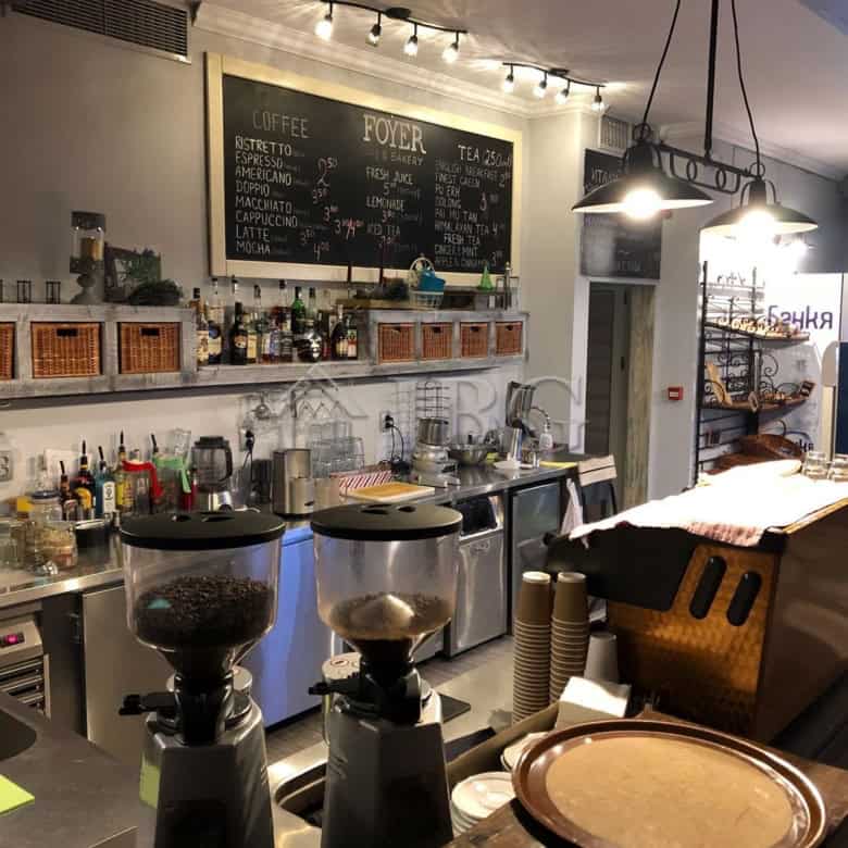 Modern restaurant interior with coffee station and bar area in Nessebar.