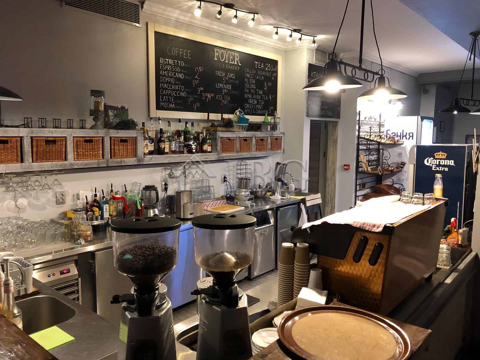 Modern restaurant interior with coffee station and bar area in Nessebar.