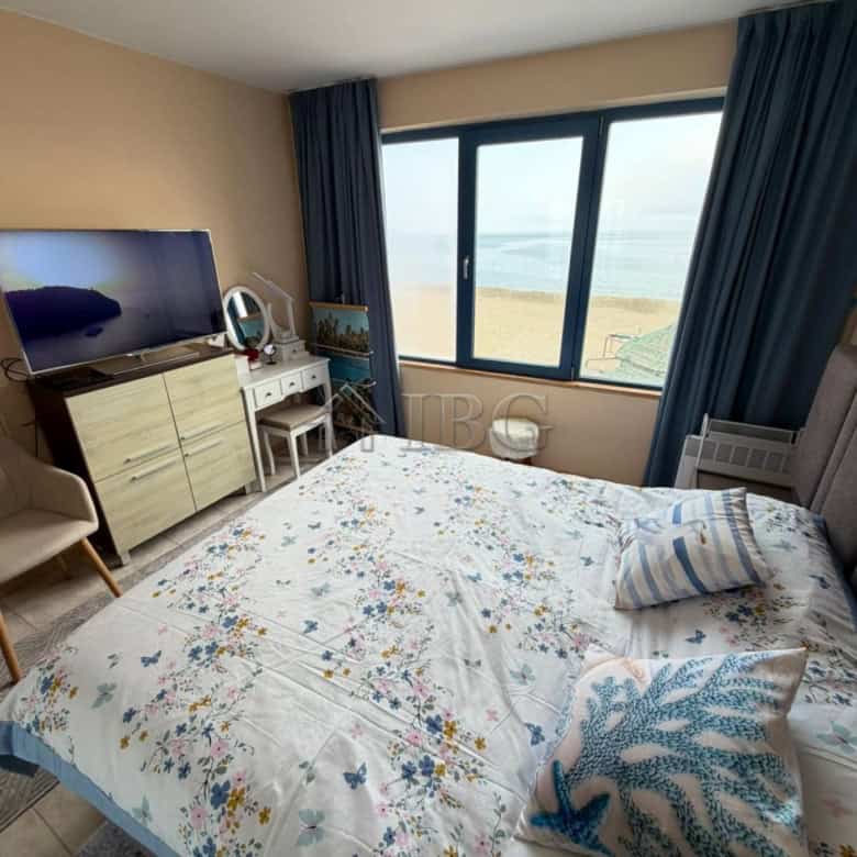Sea view bedroom with modern decor and beach access in Sunny Beach, Bulgaria.