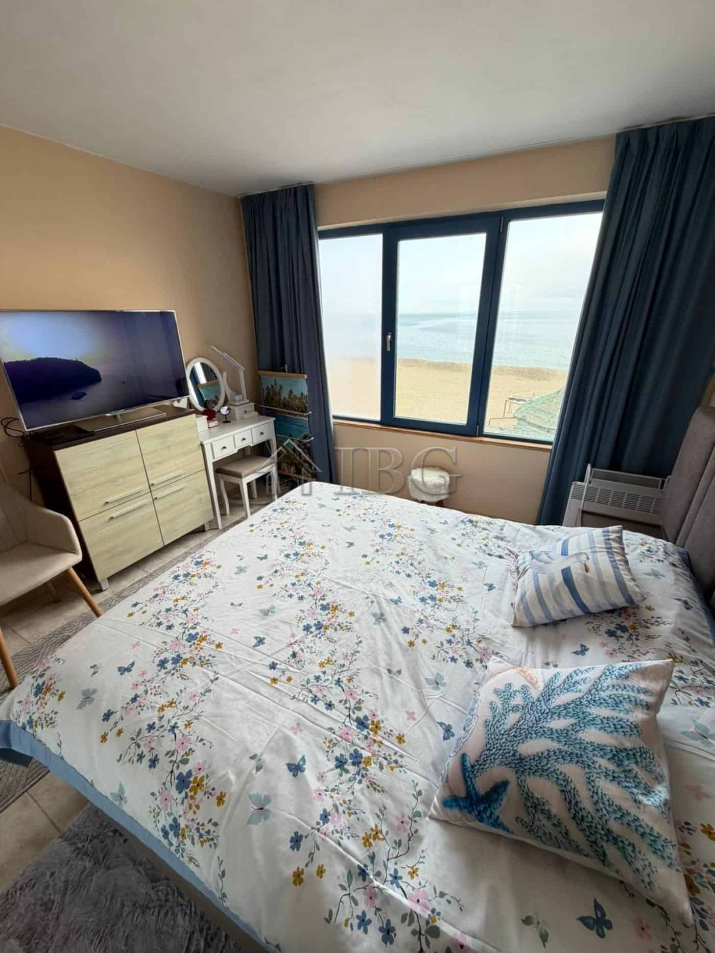Sea view bedroom with modern decor and beach access in Sunny Beach, Bulgaria.