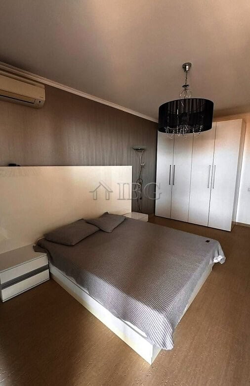 Bedroom with double bed, wardrobe, and modern decor in Sveti Vlas apartment.