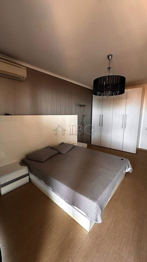 Bedroom with double bed, wardrobe, and modern decor in Sveti Vlas apartment.