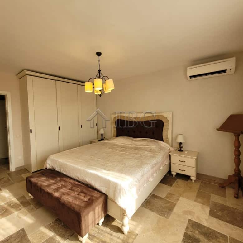 Elegant bedroom in Sveti Vlas featuring a three-level maisonette with sea vistas and modern furnishi.