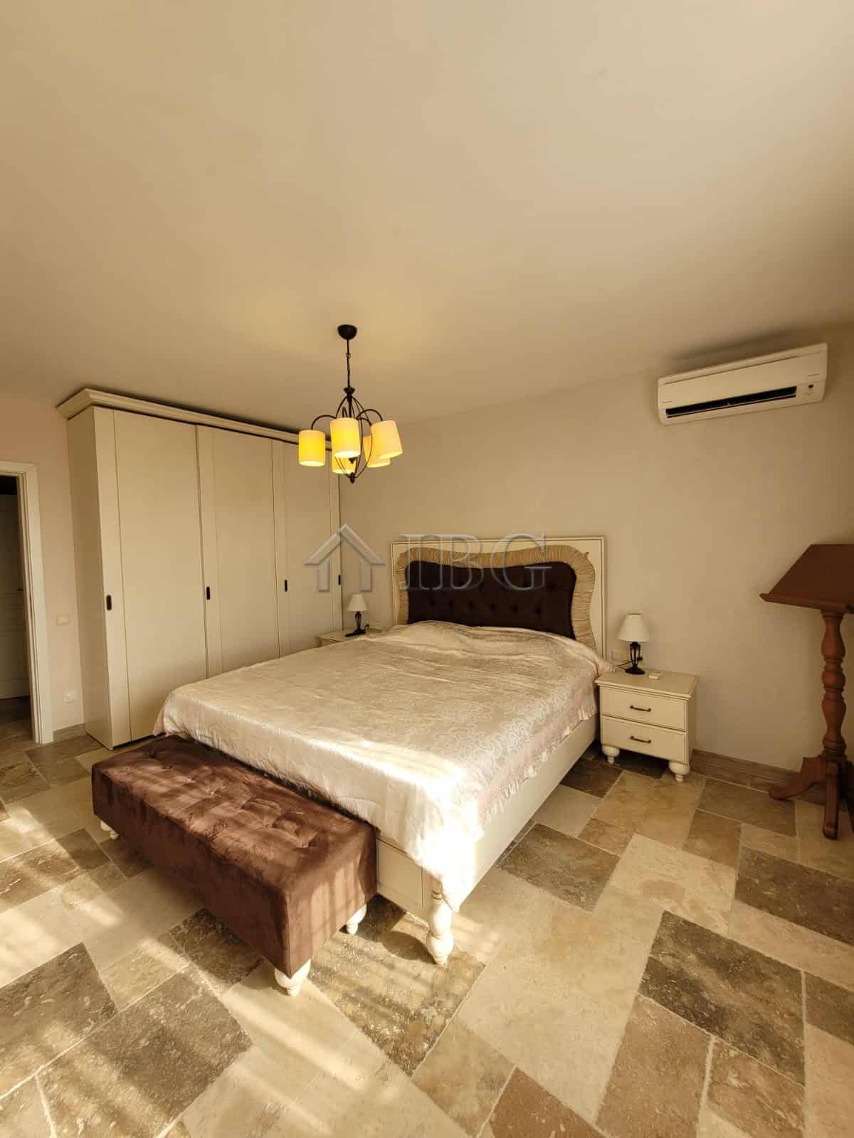 Elegant bedroom in Sveti Vlas featuring a three-level maisonette with sea vistas and modern furnishi.