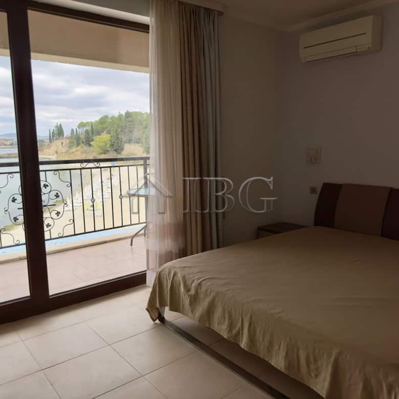 Spacious bedroom with balcony overlooking the sea and Nessebar coastline.