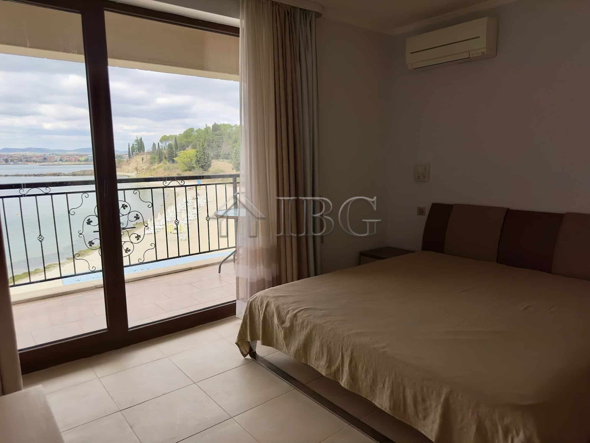 Spacious bedroom with balcony overlooking the sea and Nessebar coastline.