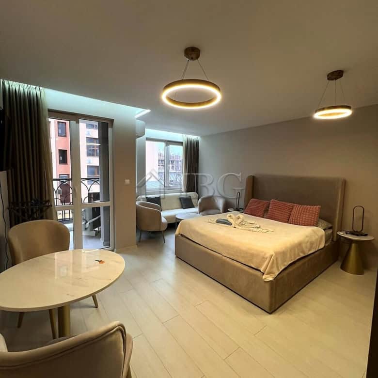 Furnished studio with balcony, modern decor, and city views in Sunny Beach.