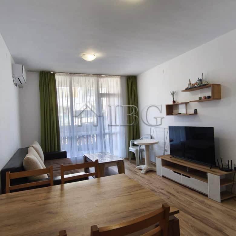 Bright living room with sofa, TV, and dining area in Chateau Aheloy 2, Aheloy.