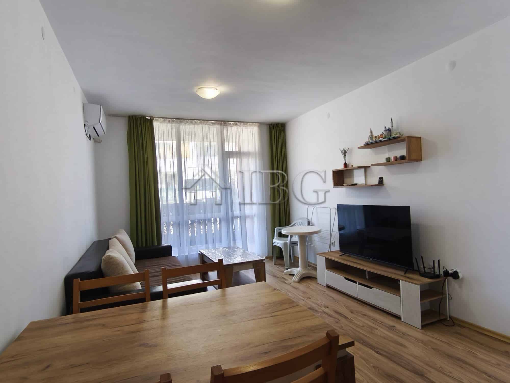 Bright living room with sofa, TV, and dining area in Chateau Aheloy 2, Aheloy.