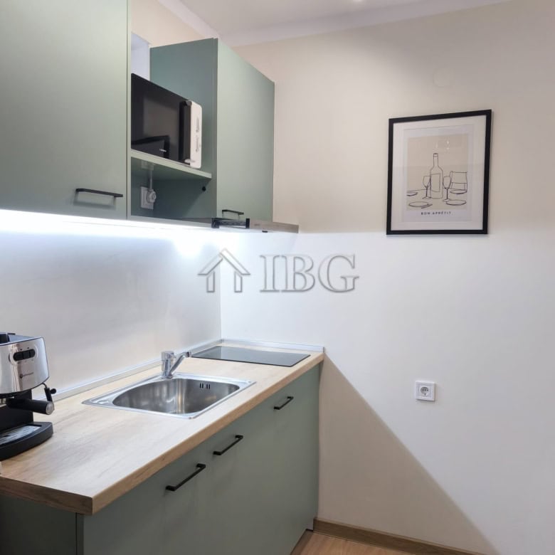 Furnished studio with balcony and sea view in Sveti Vlas, Bulgaria. Compact kitchen area with applia.