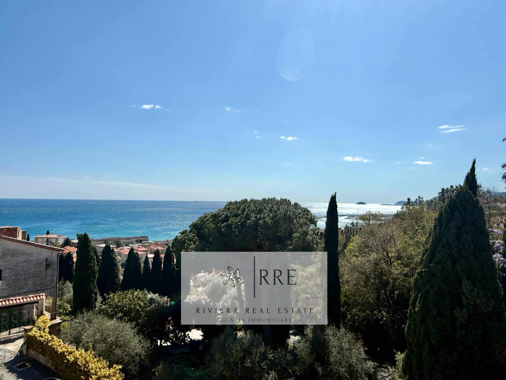 Oceanfront property with lush greenery and scenic sea views.