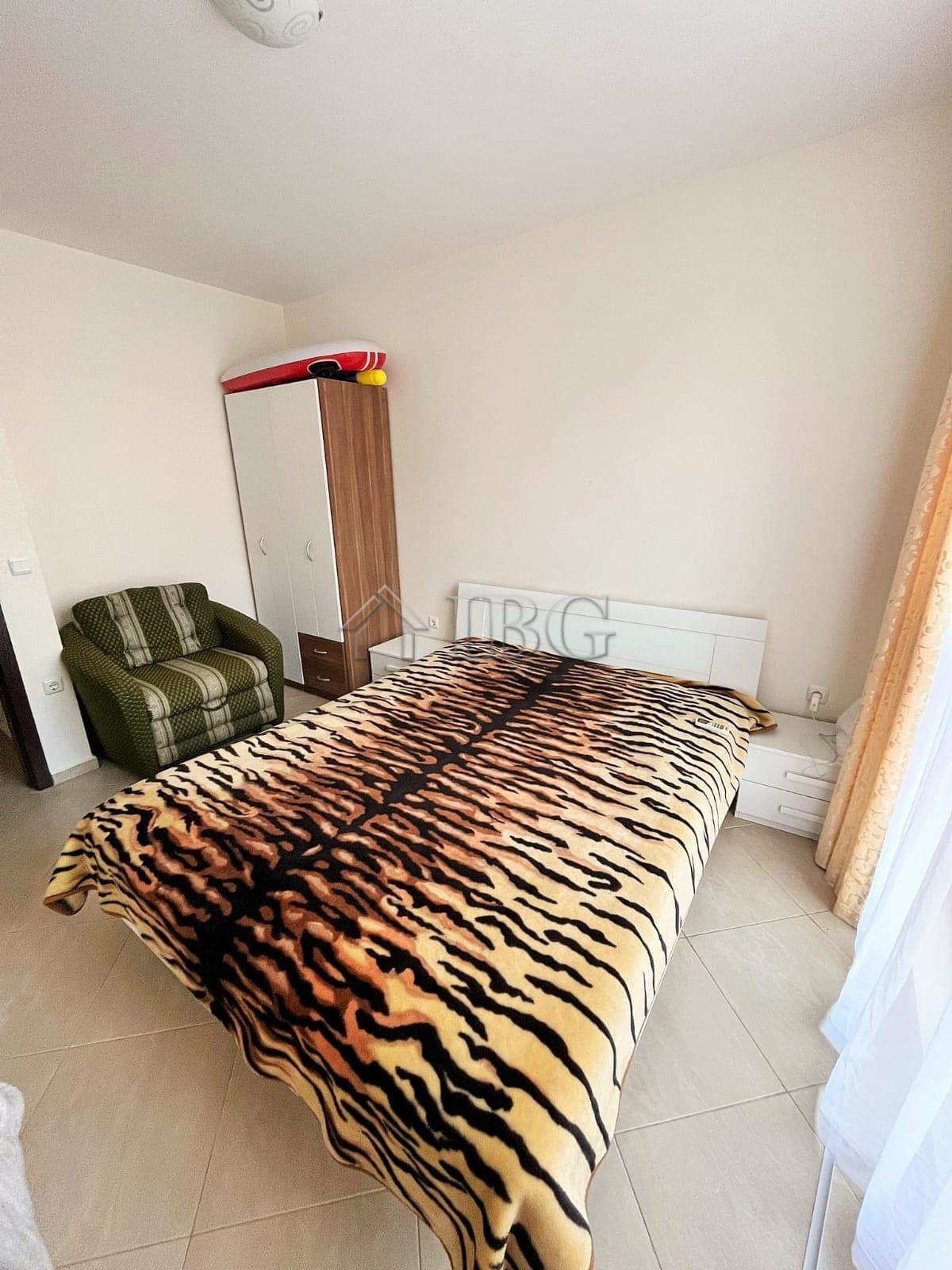 Cozy 1-bedroom apartment with tiger-print bedding in Sunny Beach, Bulgaria. Modern furnishings and b.