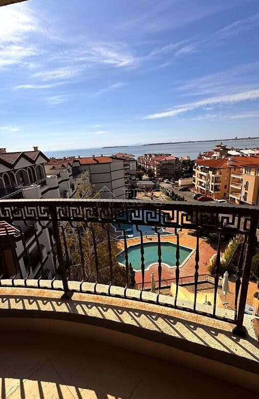 View of sea, pool, and surrounding buildings from Royal Palm apartment balcony in Sveti Vlas.