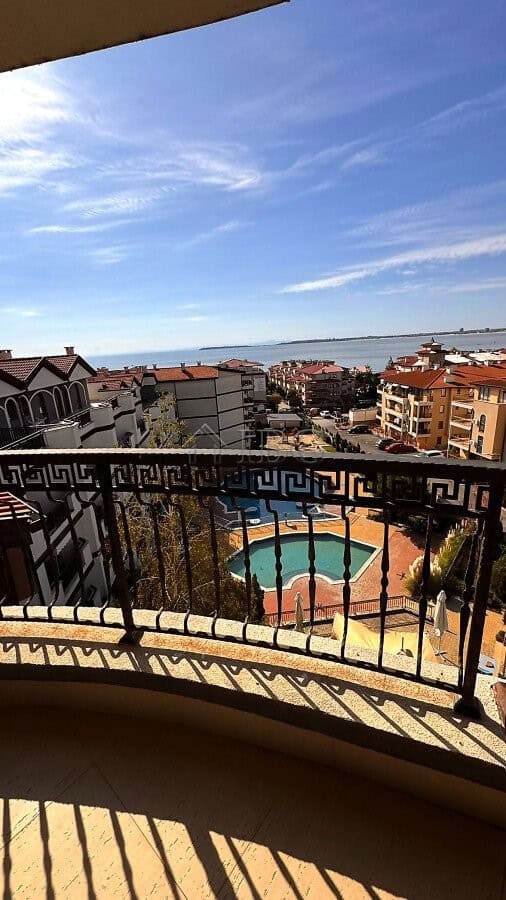 View of sea, pool, and surrounding buildings from Royal Palm apartment balcony in Sveti Vlas.