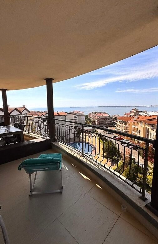 Balcony overlooking the sea and pool at Royal Palm apartment in Sveti Vlas. Enjoy stunning ocean vie.