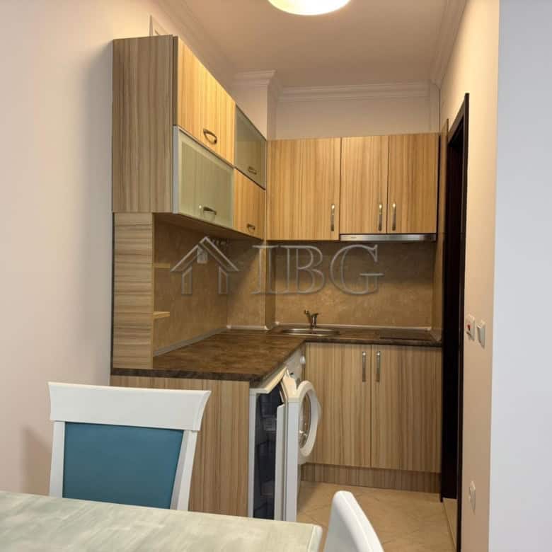 Bright studio apartment with balcony overlooking lush green yard in Cascadas Complex, Sunny Beach.