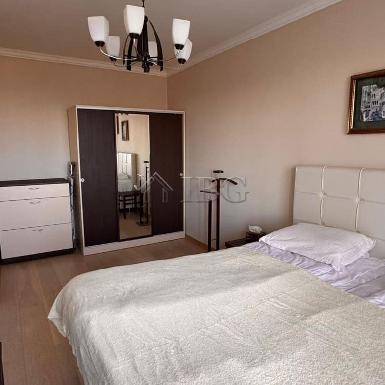 Comfortable bedroom in Sveti Vlas with modern furnishings and neutral tones.