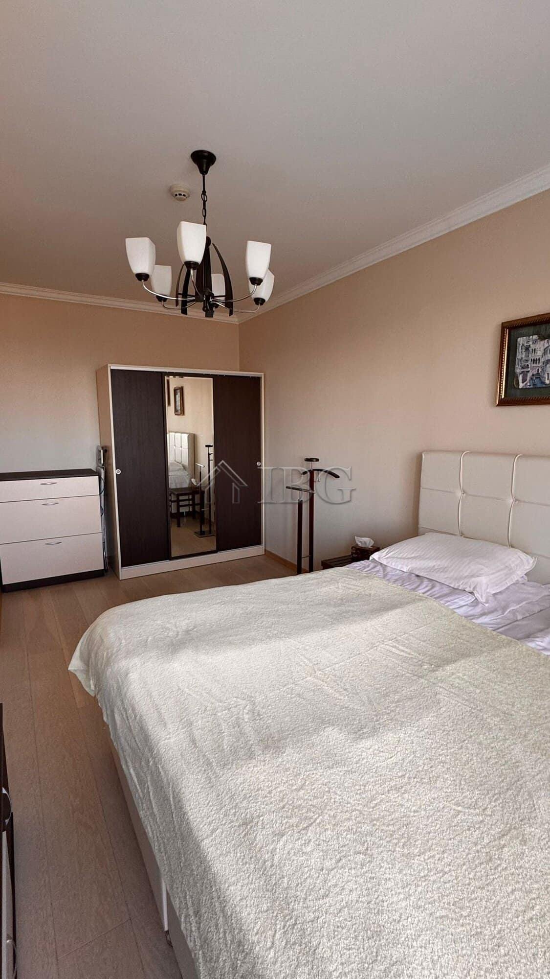 Comfortable bedroom in Sveti Vlas with modern furnishings and neutral tones.