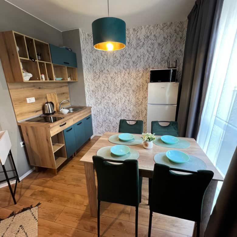 Bright, stylish living space with dining area and kitchen.