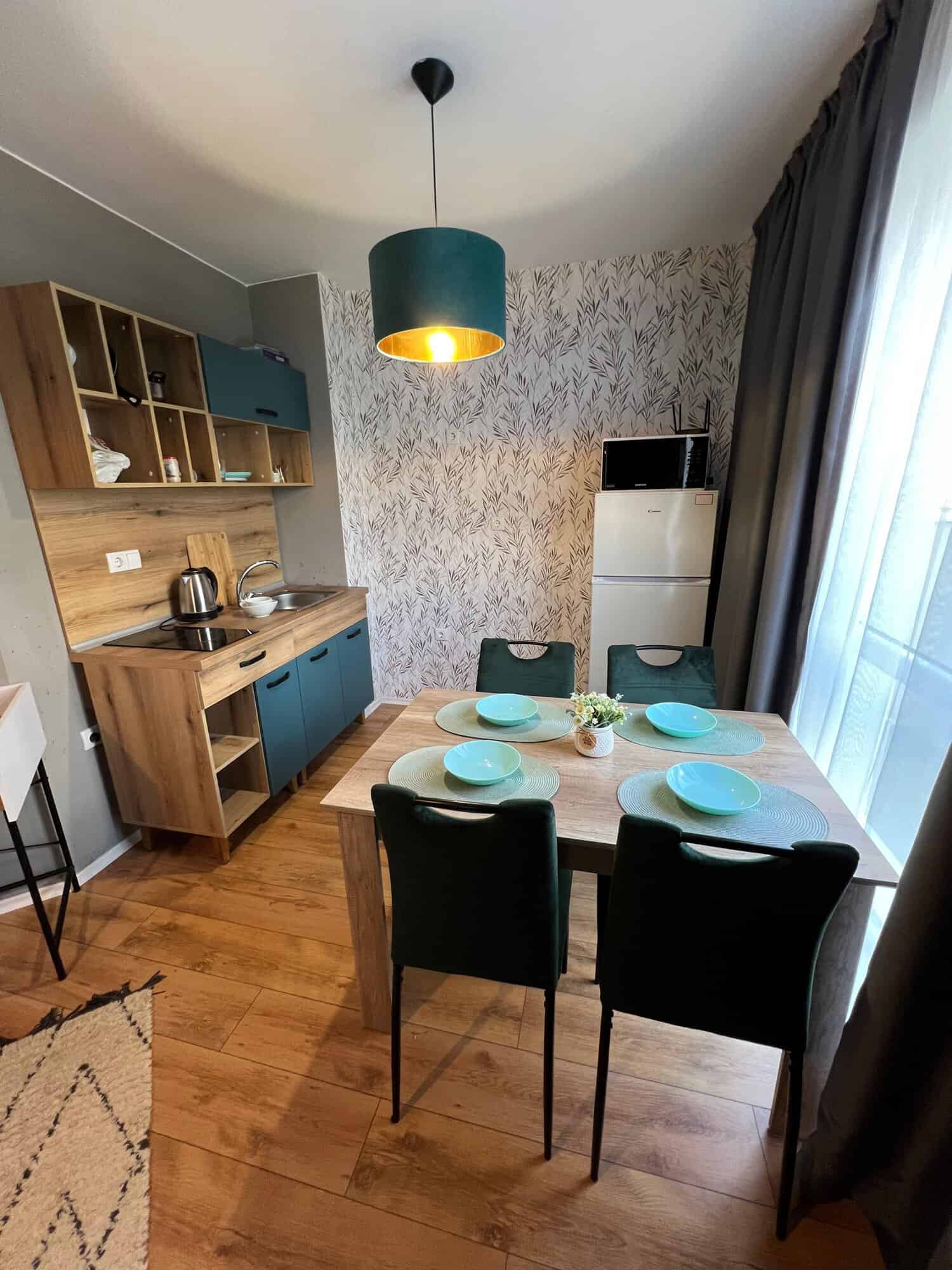Bright, stylish living space with dining area and kitchen.