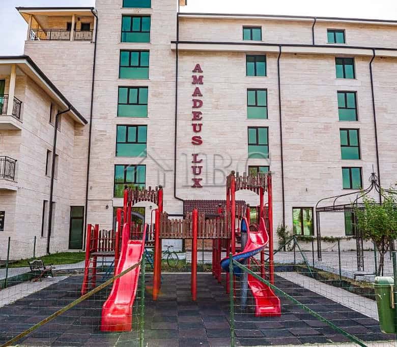 Apartment building exterior with children's playground in Sunny Beach, Bulgaria.
