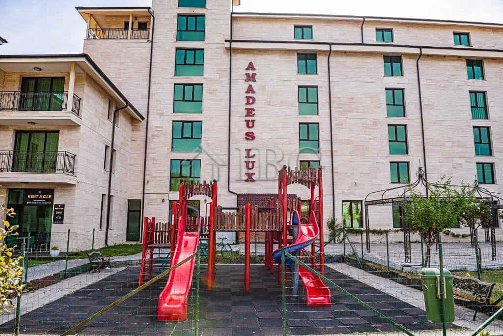 Apartment building exterior with children's playground in Sunny Beach, Bulgaria.