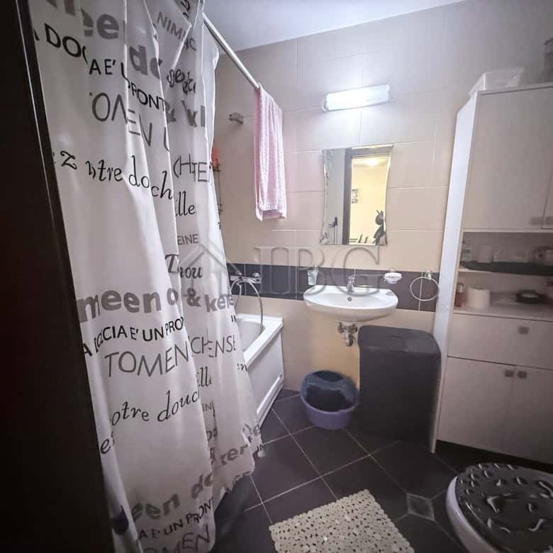 Bright bathroom with modern fixtures and storage in Amadeus Lux, Sunny Beach.
