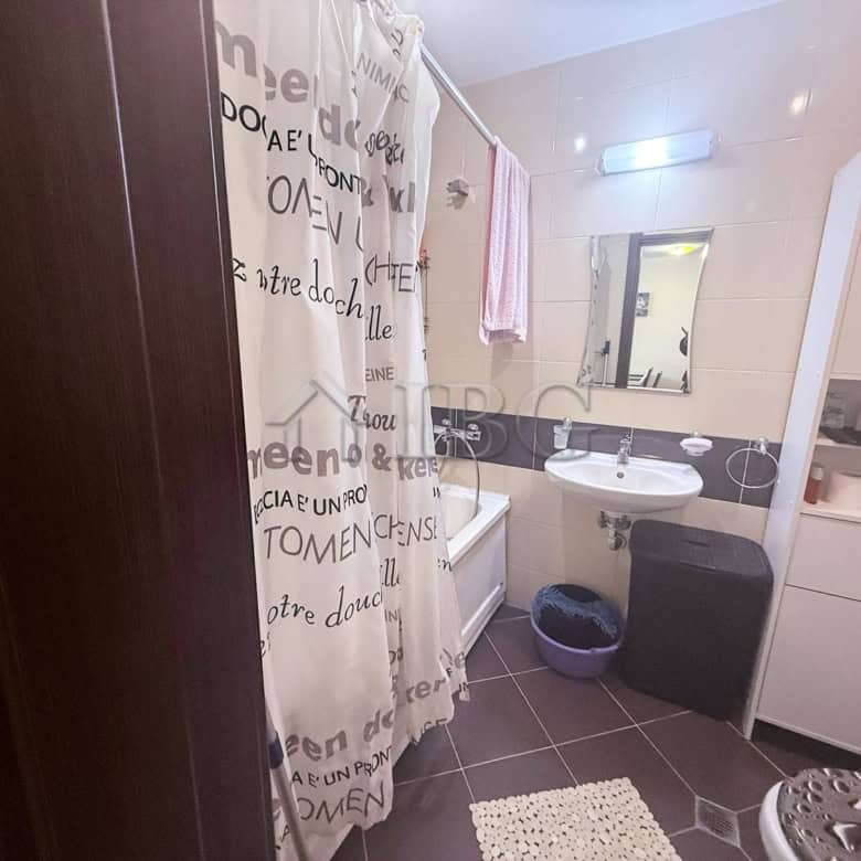 Bright bathroom with modern fixtures and storage in Amadeus Lux apartment, Sunny Beach.