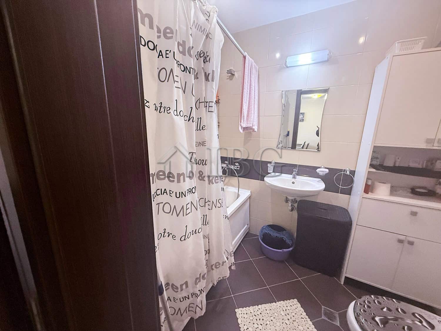 Bright bathroom with modern fixtures and storage in Amadeus Lux apartment, Sunny Beach.