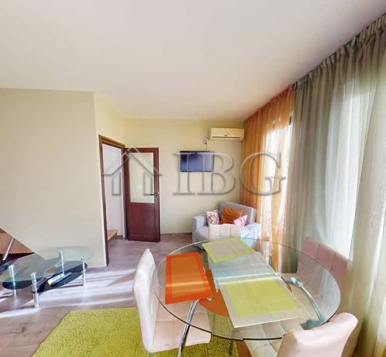 Bright living room with pool view, one-bedroom apartment, two bathrooms at Amber Beach, Sunny Beach.