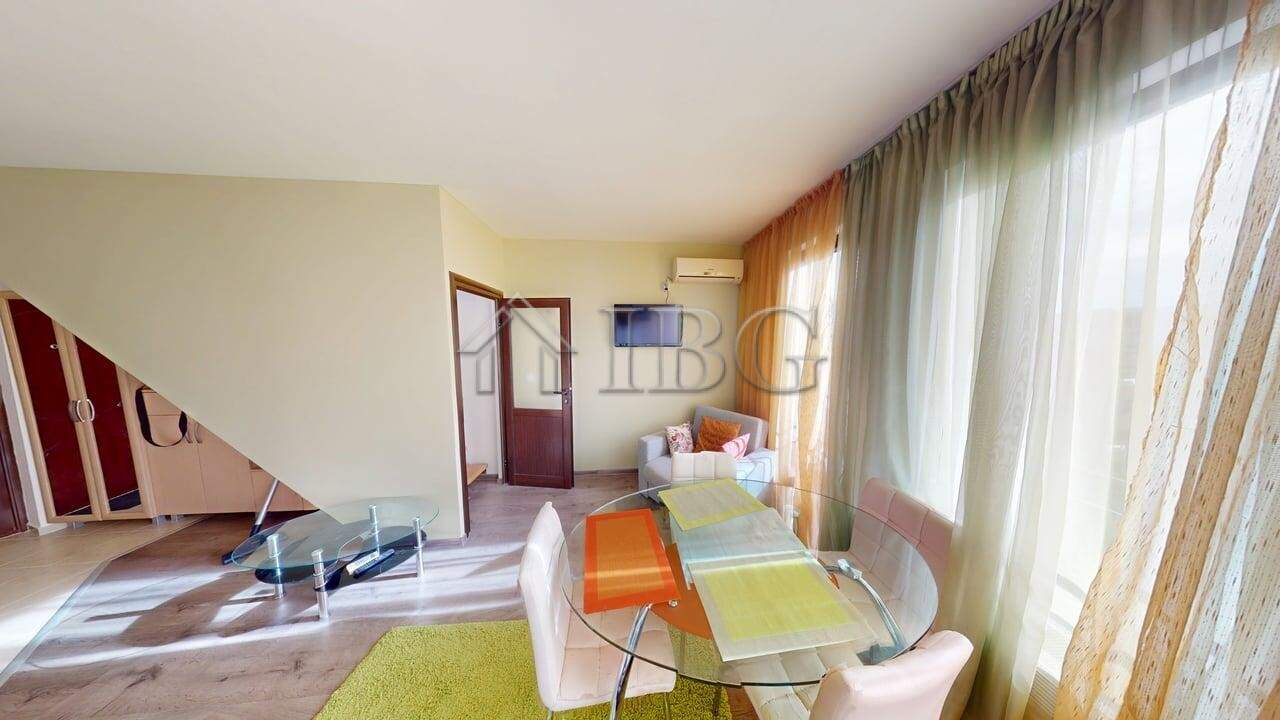 Bright living room with pool view, one-bedroom apartment, two bathrooms at Amber Beach, Sunny Beach.