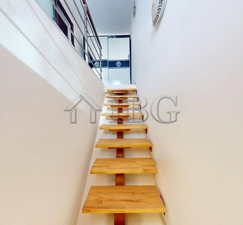 Staircase leading to a sunny beach apartment with a pool view at Amber Beach Complex, Sunny Beach.