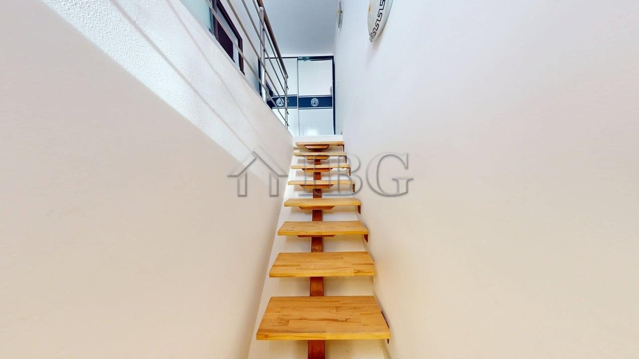 Staircase leading to a sunny beach apartment with a pool view at Amber Beach Complex, Sunny Beach.
