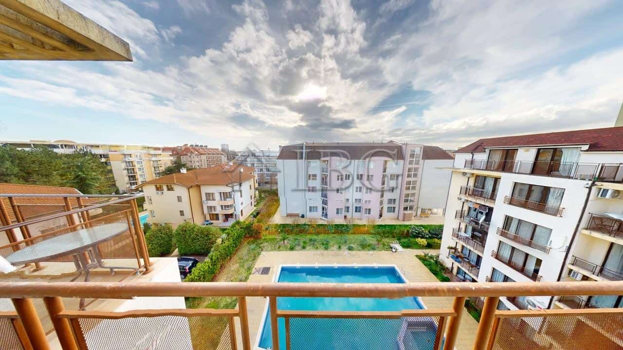 View of pool and surrounding buildings from a one-bedroom apartment balcony in Sunny Beach.