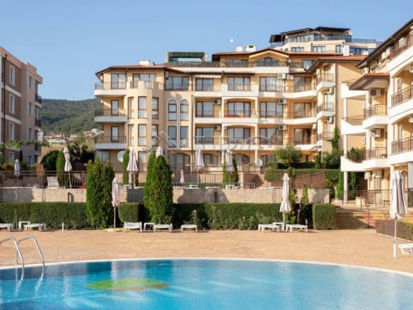 Apartment in Aqua Dreams, Sveti Vlas with pool and outdoor lounging area.