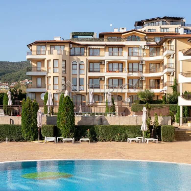 Apartment in Aqua Dreams, Sveti Vlas with pool and outdoor lounging area.