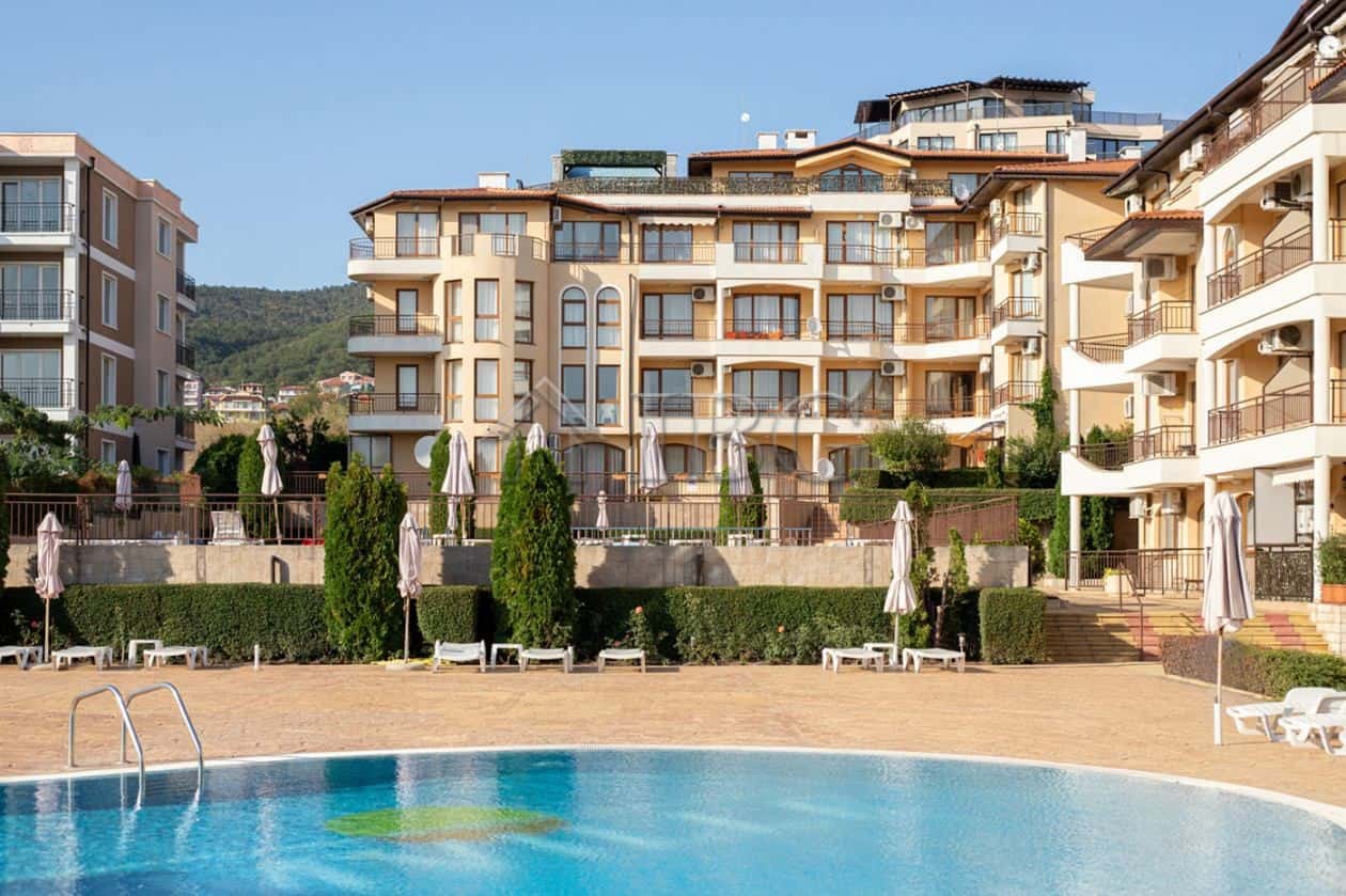 Apartment in Aqua Dreams, Sveti Vlas with pool and outdoor lounging area.