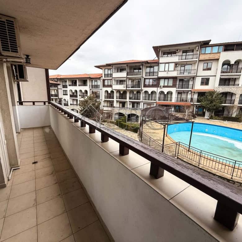 Balcony view of the apartment overlooking the pool and surrounding buildings in Sveti Vlas.
