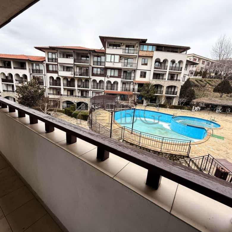 Bright balcony view of apartment complex and swimming pool in Sveti Vlas.