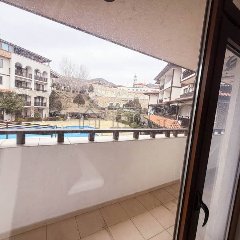 Balcony view from a furnished one-bedroom apartment in Sveti Vlas, overlooking the sea and surroundi.
