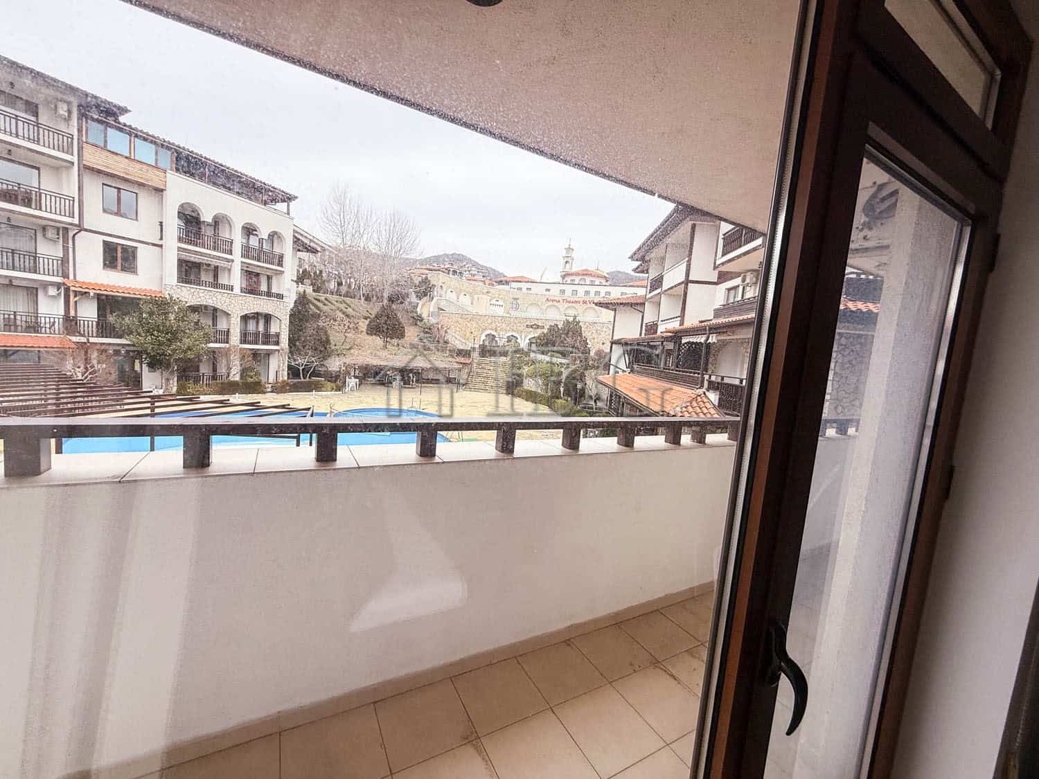 Balcony view from a furnished one-bedroom apartment in Sveti Vlas, overlooking the sea and surroundi.