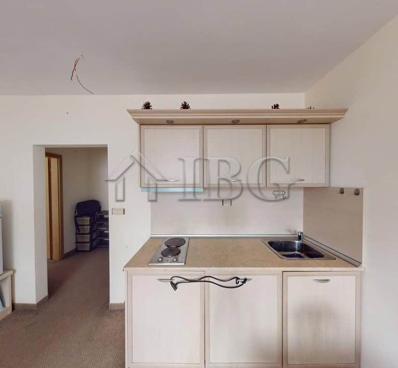 Compact kitchen in Avalon, Sunny Beach apartment with basic appliances and light-colored cabinets.