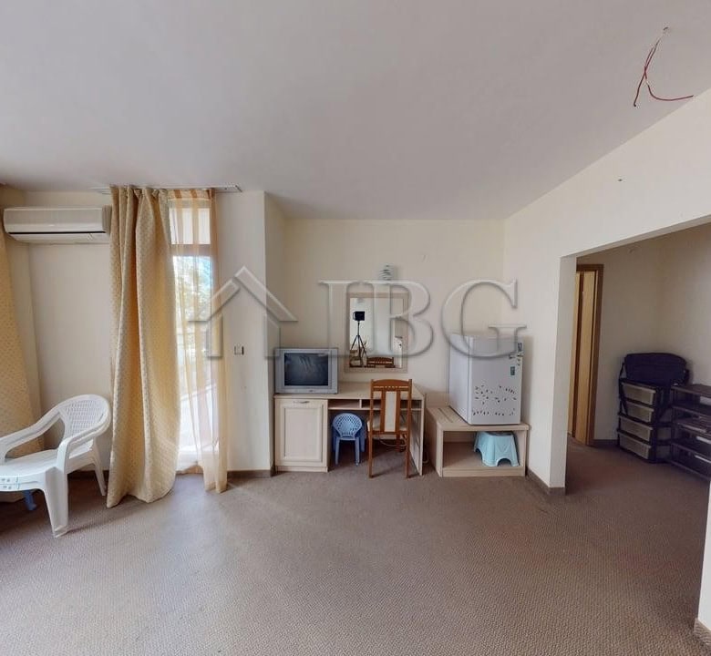 Bright interior of a one-bedroom apartment in Sunny Beach, Bulgaria, featuring a living area with la.