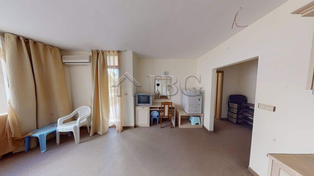 Bright interior of a one-bedroom apartment in Sunny Beach, Bulgaria, featuring a living area with la.