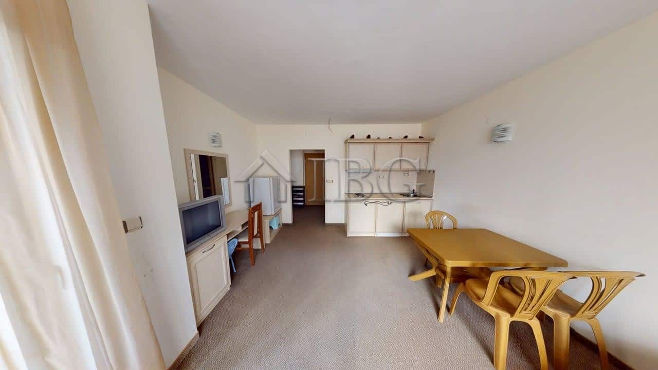 Bright living room of a one-bedroom apartment in Avalon, Sunny Beach, with modern furniture and open.