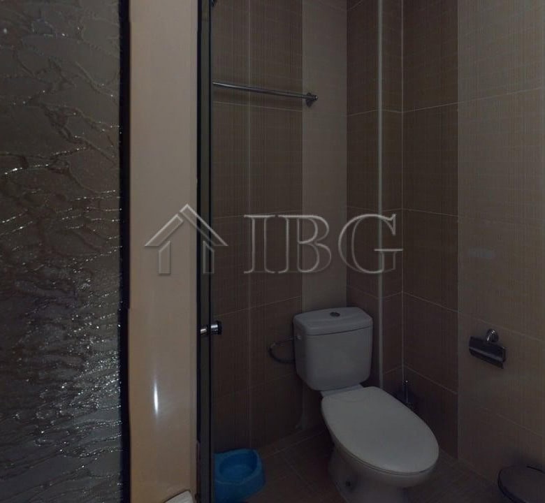 Small bathroom in Avalon apartment with toilet and shower in Sunny Beach, Bulgaria.