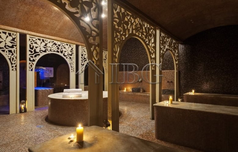 Luxury spa interior with ambient lighting and ornate decor.