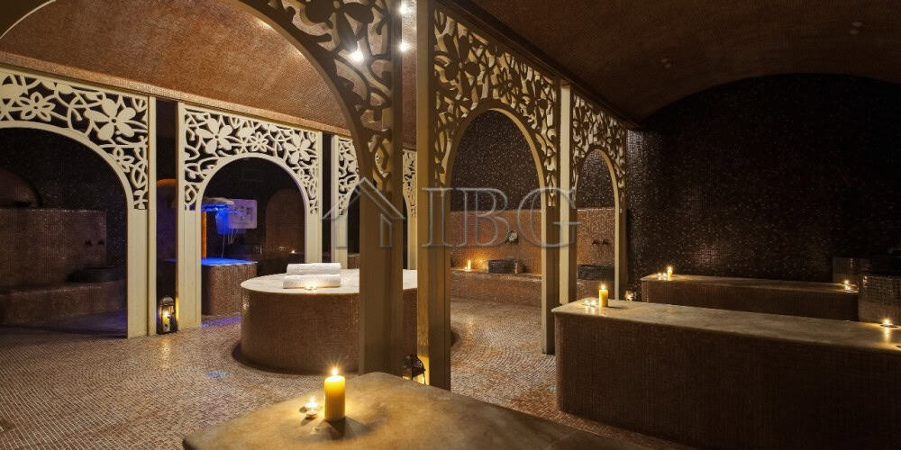 Luxury spa interior with ambient lighting and ornate decor.