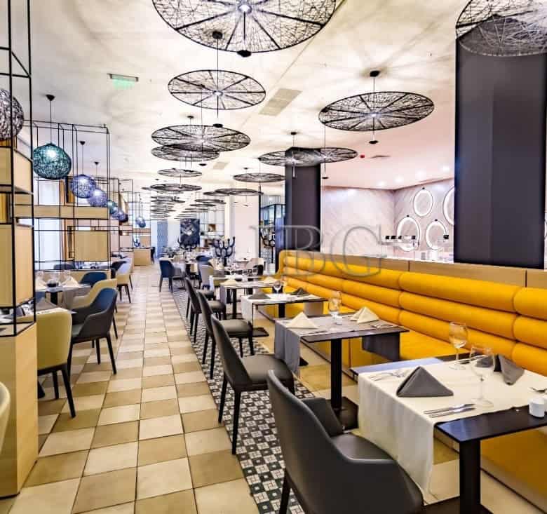 Elegant restaurant dining area with contemporary design and cozy ambiance.