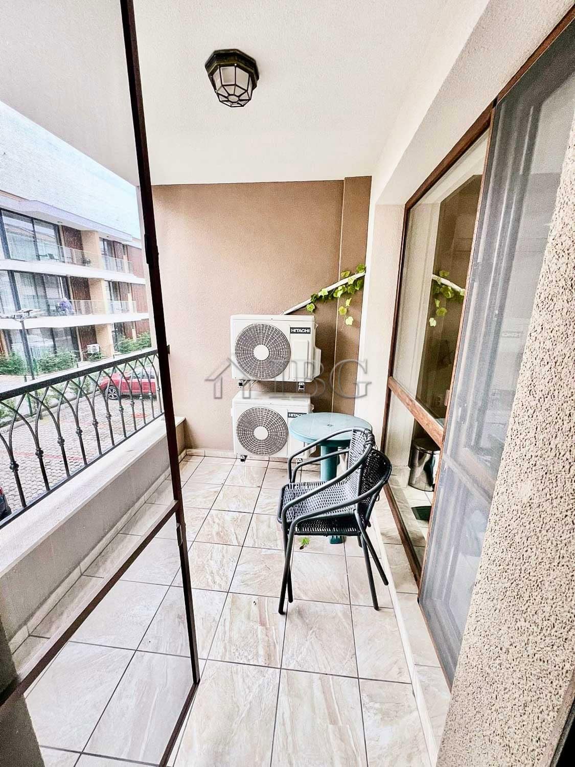 Bright balcony with sea view and outdoor seating in Burgas Beach Resort.